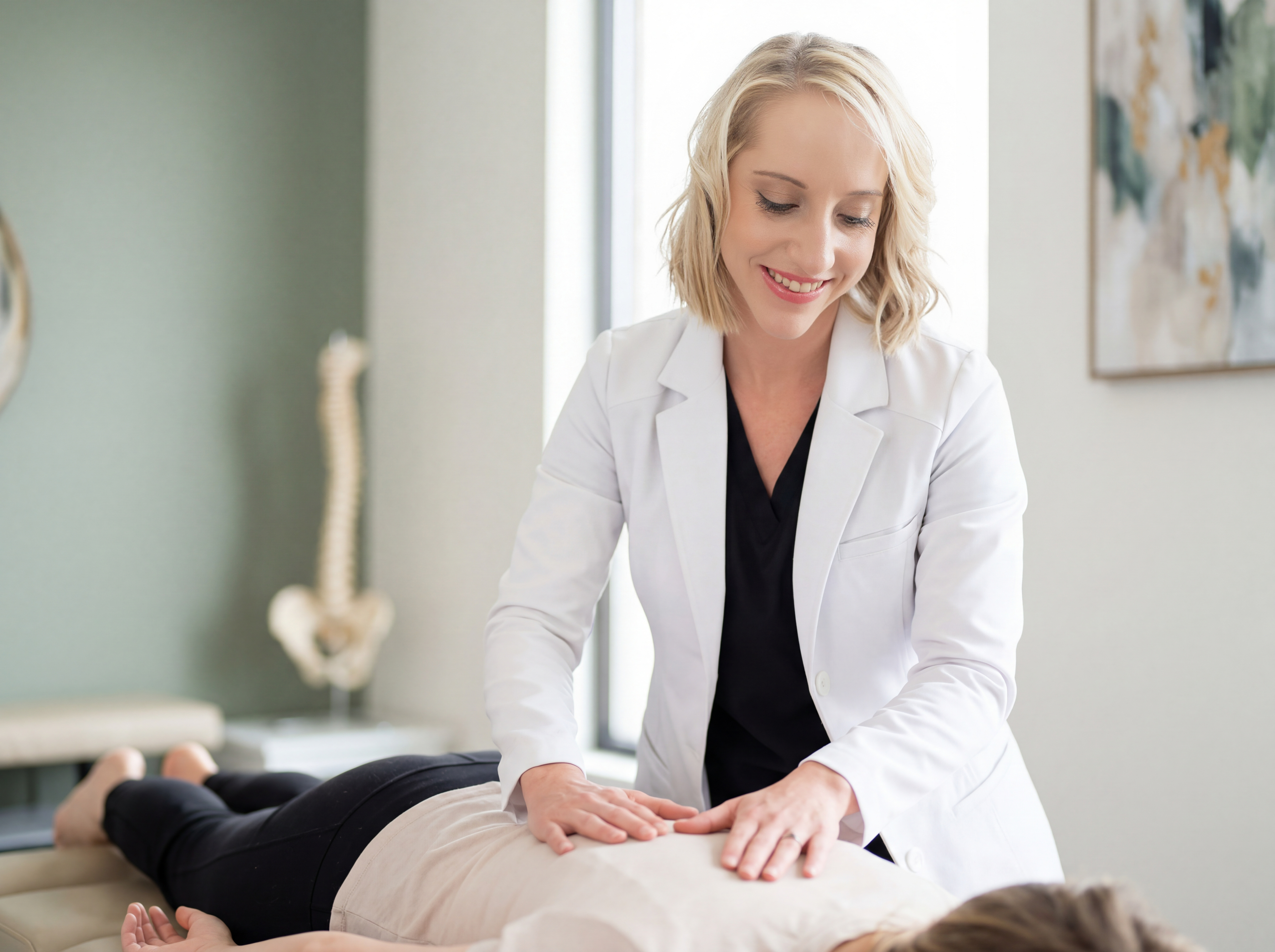 Dr Kate Phillips performing a chiropractic adjustment